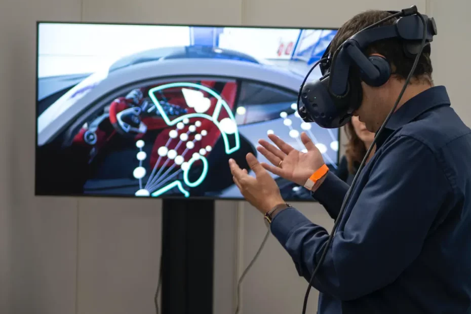 person wearing VR Headset while standing in front of TV screen